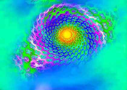 Intricate green, purple, and blue spiral fractal with a sun-like center in yellow and orange hues