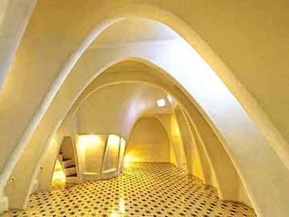 Loft area of Casa Batlló in Barcelona with sixty parabolic arches, exemplifying Gaudi's innovative design.