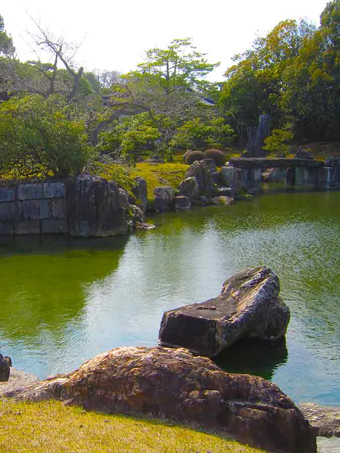 Pond framed with rocks Nijo-jo Garden Kyoto, photo by Wiesław Sadurski